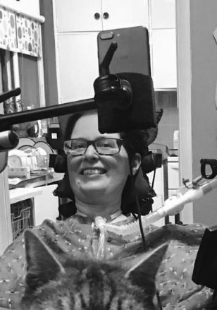 Dr Kirsten in wheelchair with cat