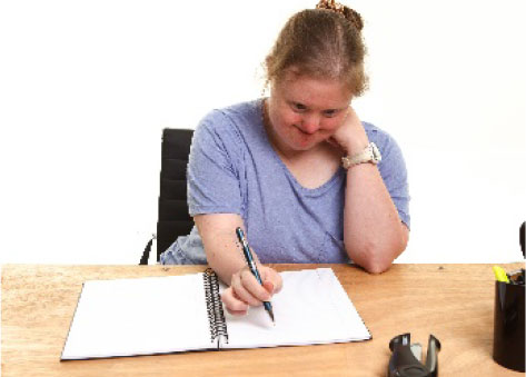 Woman signing a document