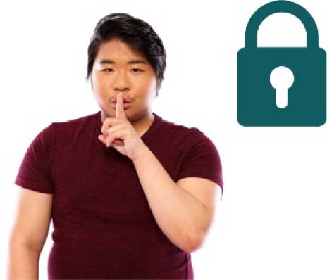 Man with his finger to his lips in a shh motion
