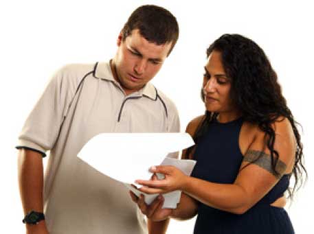 Two people reading a document