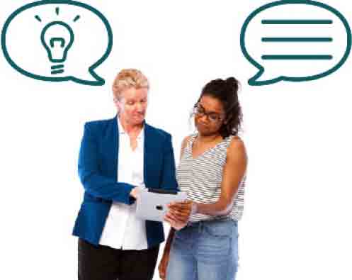 Two women looking at a sheet of paper