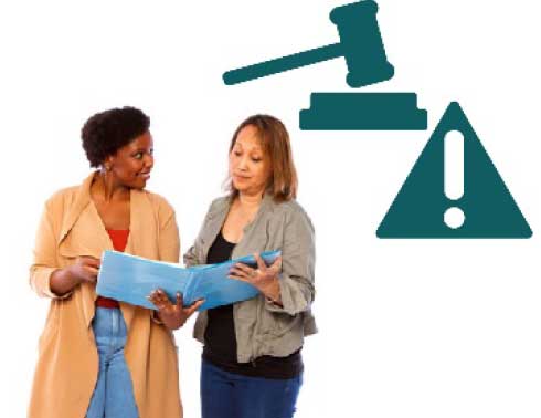 Two women discussing a document they are looking at
