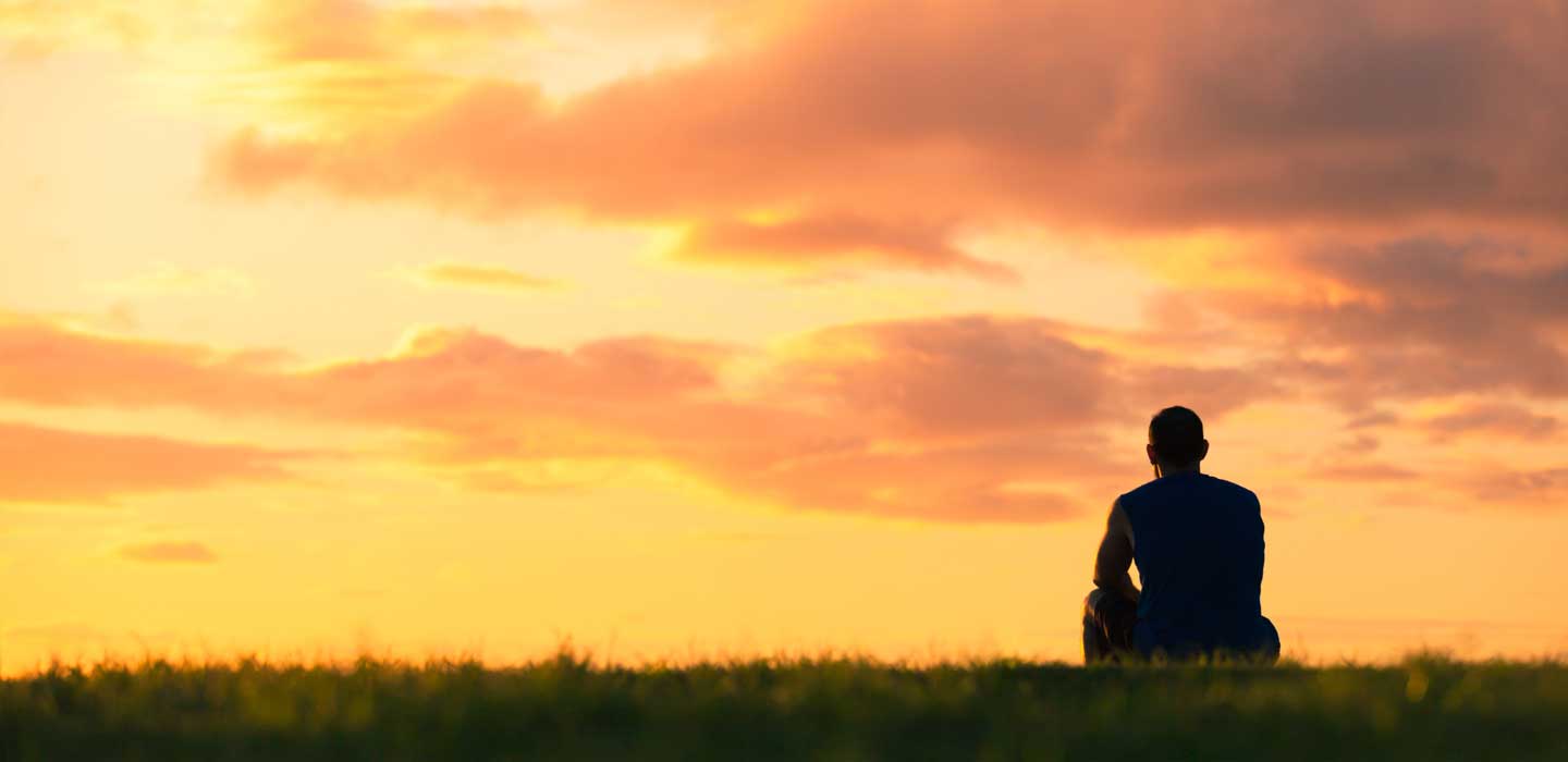 silhouette of Mark with orange sunset